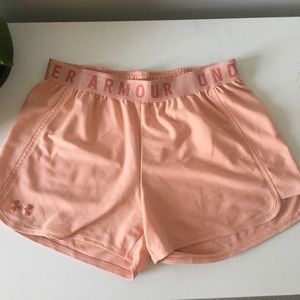 Woman’s loose light pink athletic under armour shorts